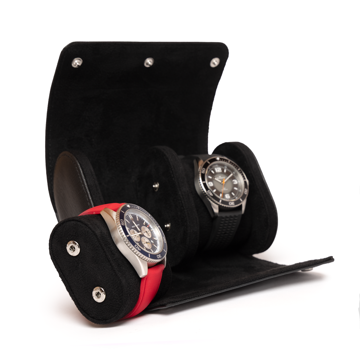 Kennett black Saffiano leather double watch roll open, holding two watches on red and black straps, one cushion removed