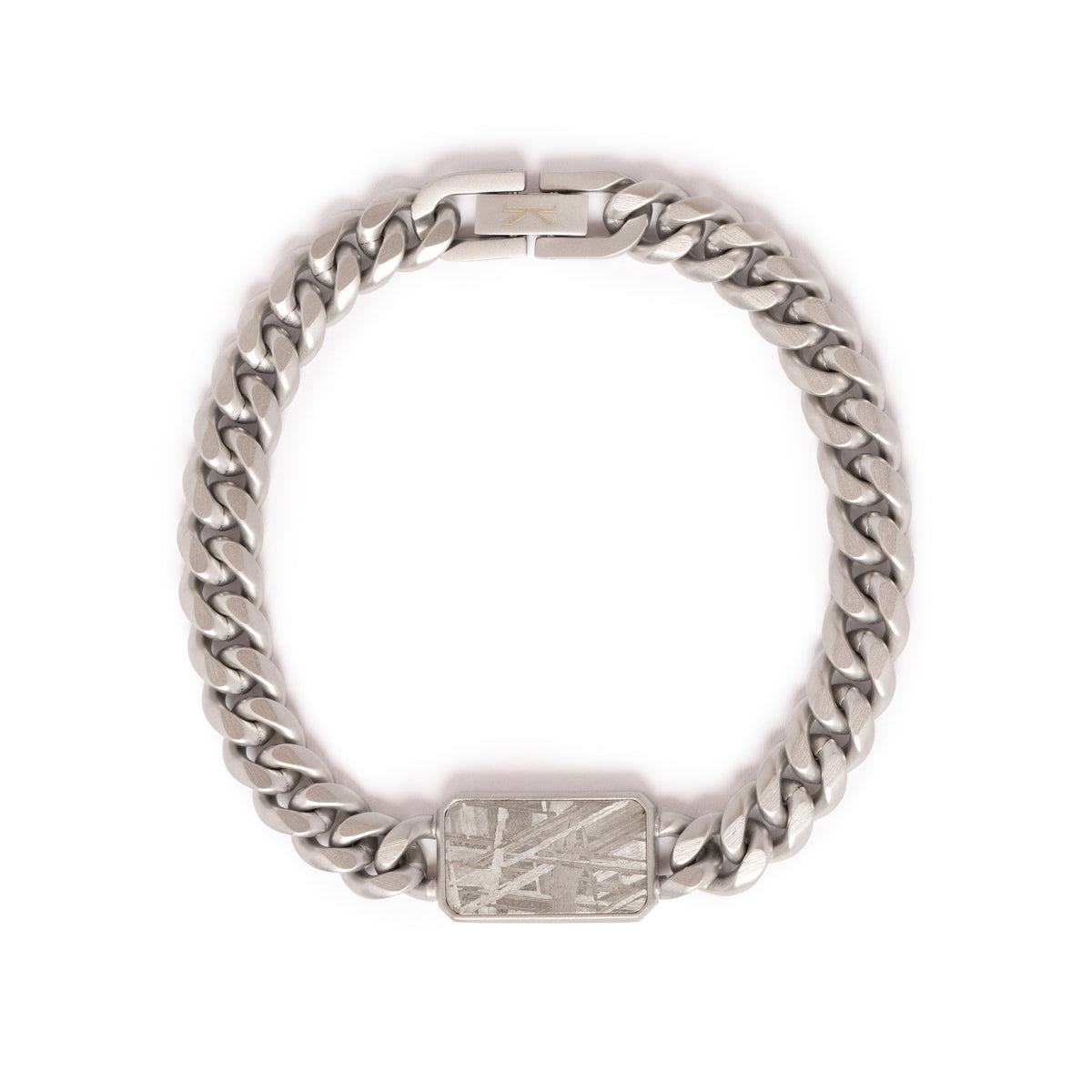 Kennett Meteorite Curb Chain Bracelet laid flat, 8.2mm brushed stainless steel curb chain with a rectangular meteorite inlay showing Widmanstätten patterns