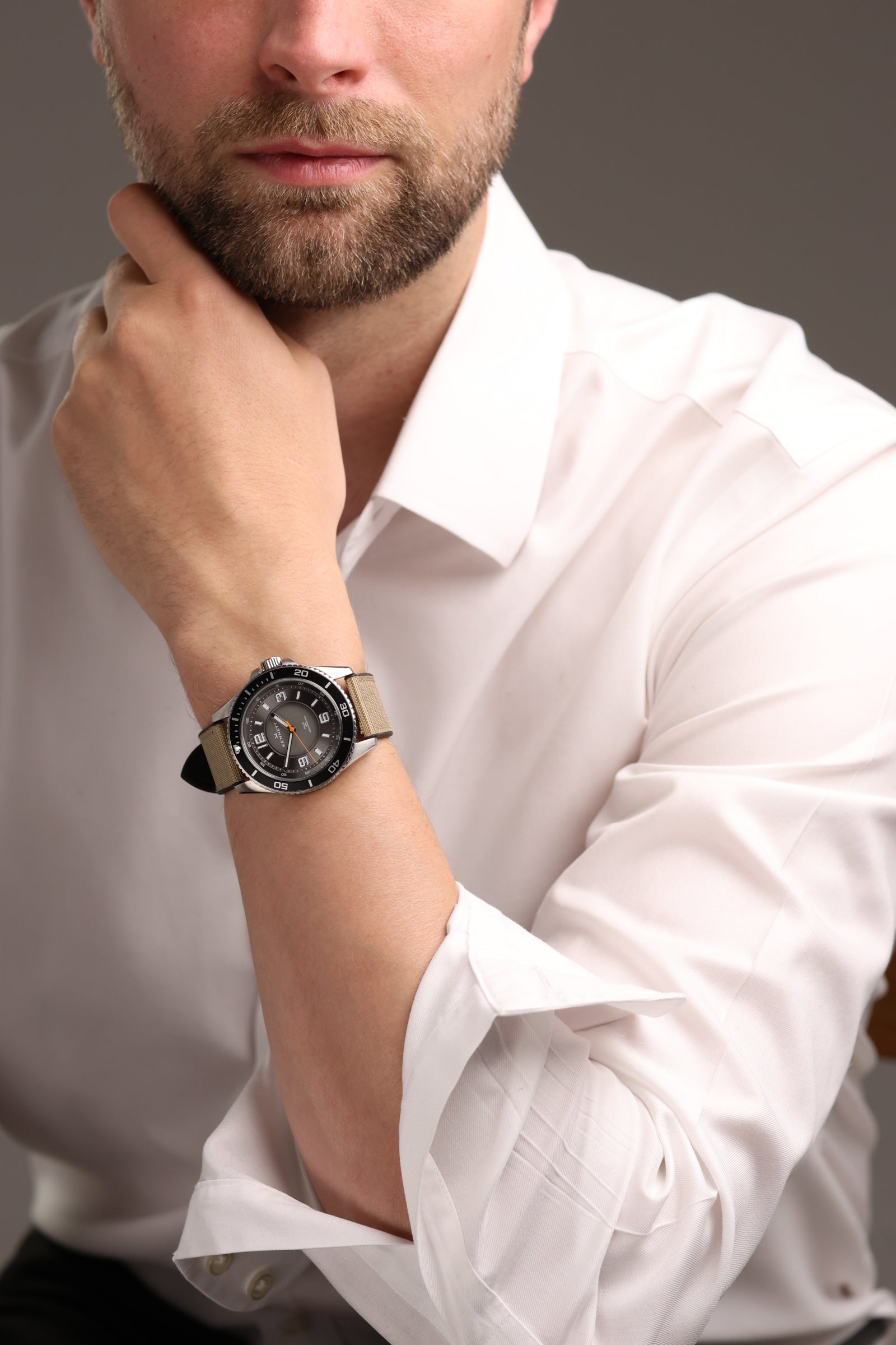 Kennett model wearing white formal shirt with the Solaxplorer watch in Sand colour strap