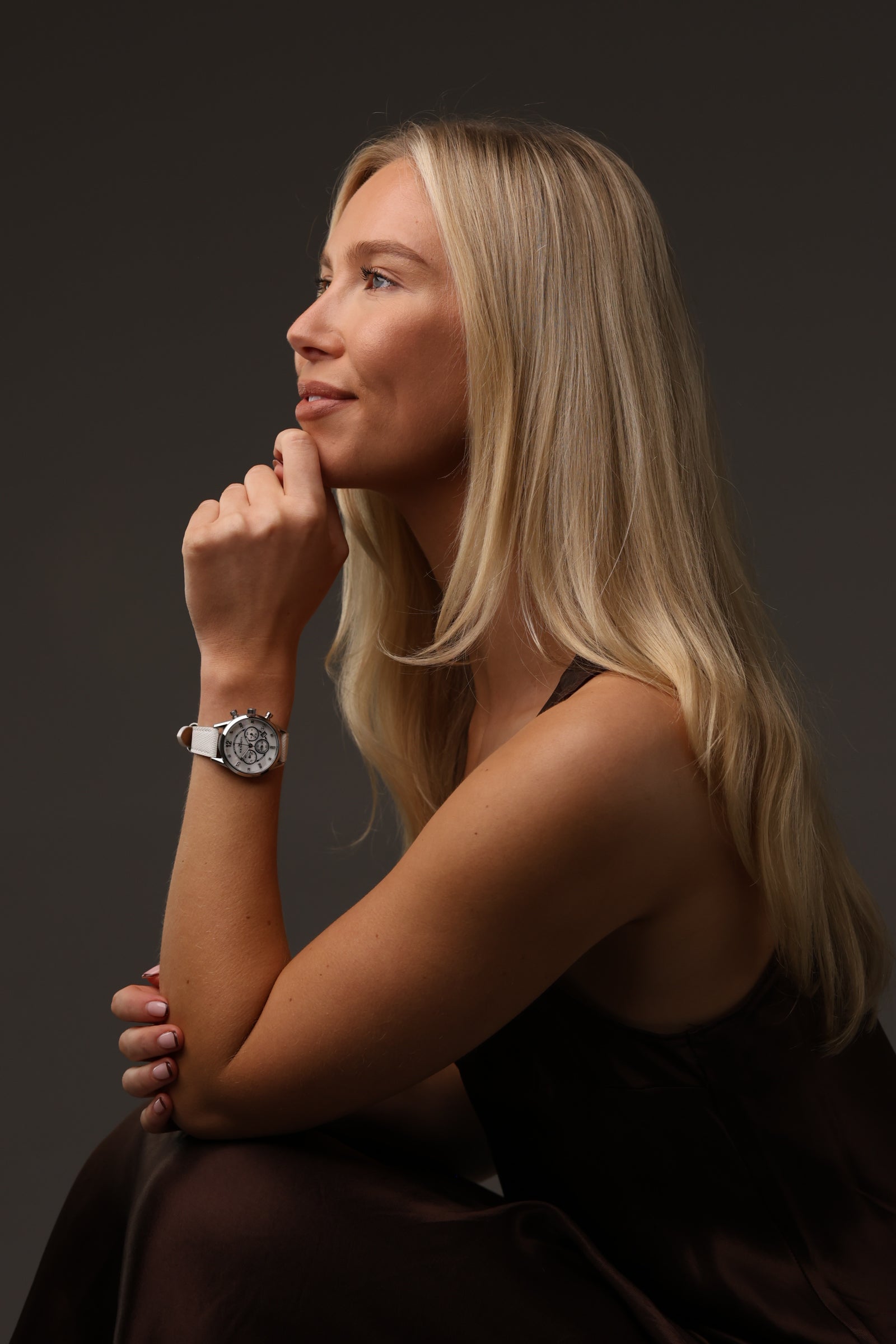 Female model wearing white Lady Savro watch by Kennett