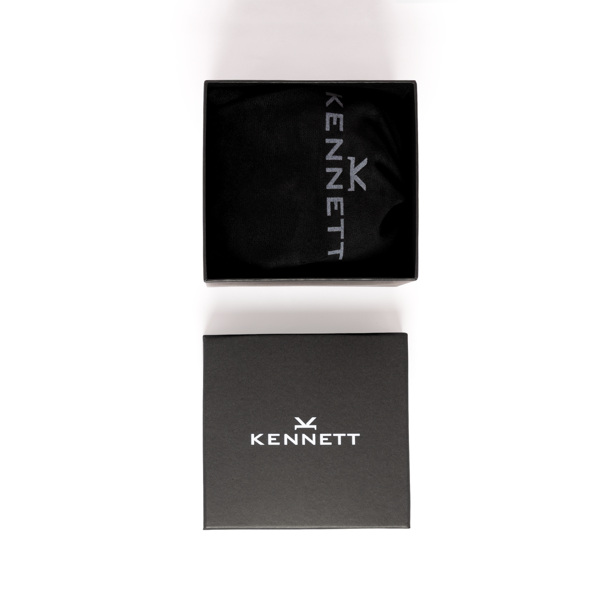 Kennett black dust pouch with Kennett logo above the branded black gift box supplied with the single watch roll